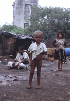 child in unhygienic slum