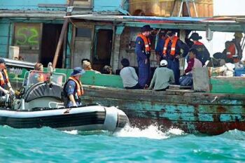 illegal fishing boat being seized