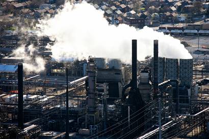 factory belches coal smoke